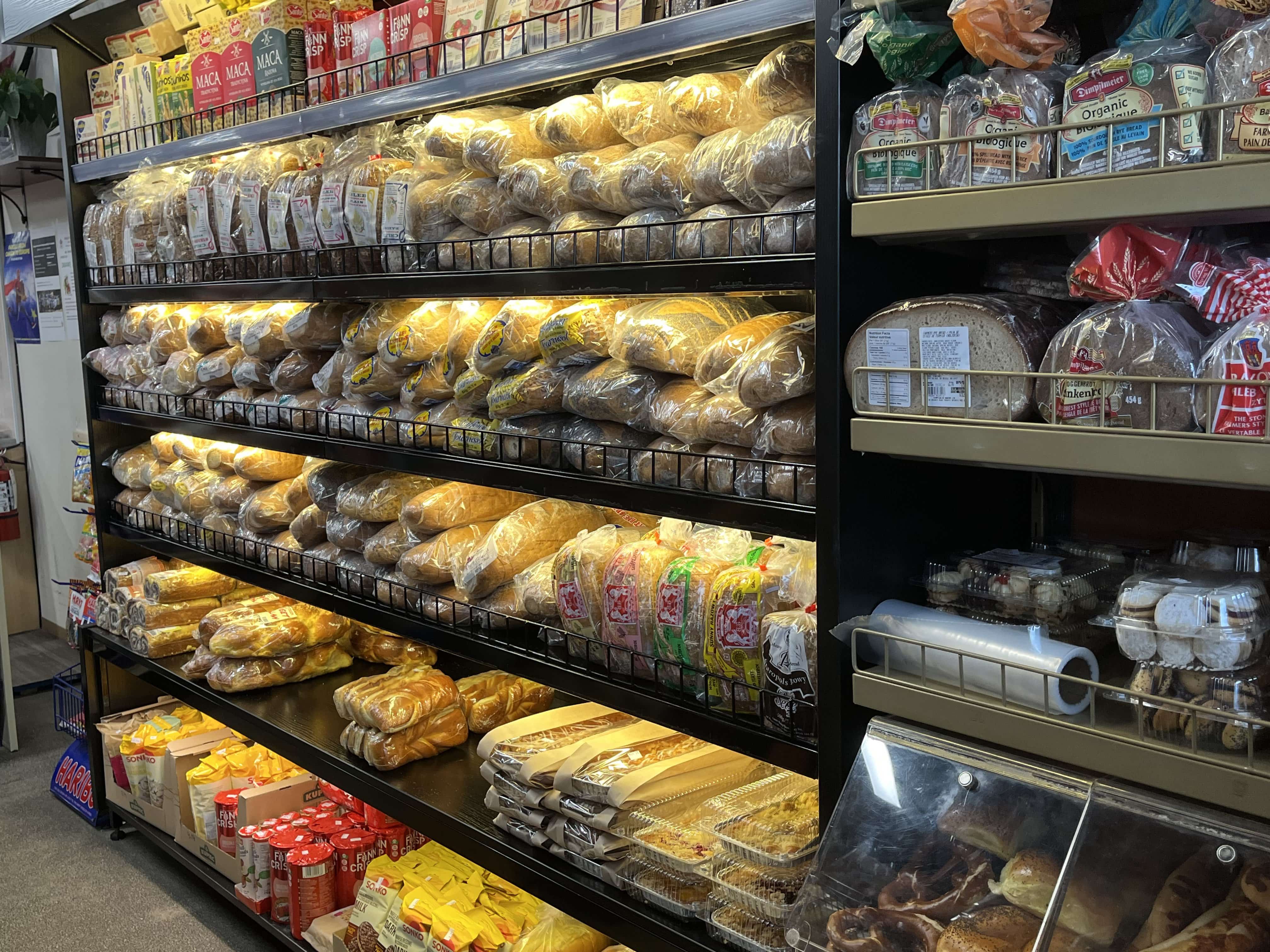 Various packaged bread loaves on display